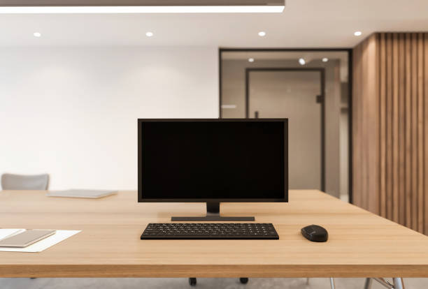 istock Blank computer monitor on office desk 1308089198