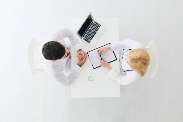 istock Female doctor consults patient 1308089701