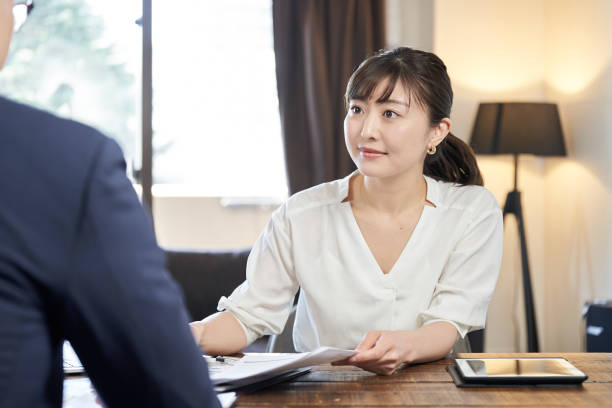 istock Asian female business woman explaining 1308090300