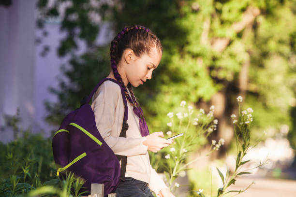 istock Child girl using smartphone 1308090491