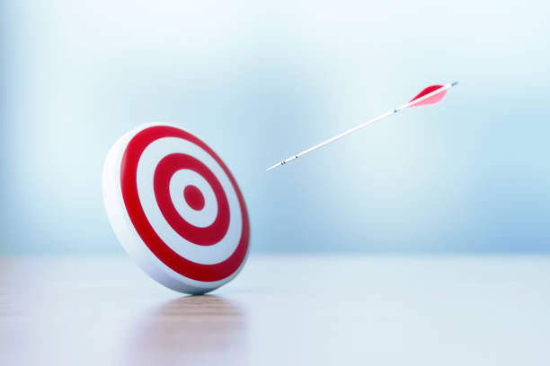 istock Success And Accuracy Concept - Red Dartboard and Arrows Sitting Before Defocused Background 1308091536