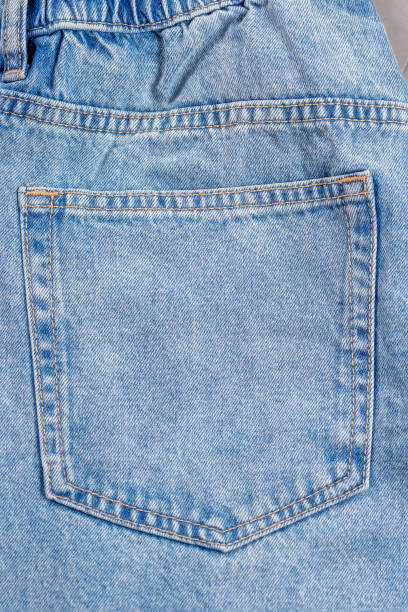 istock Close-up of blue jeans pocket showing fabric texture and stitching 1308091582