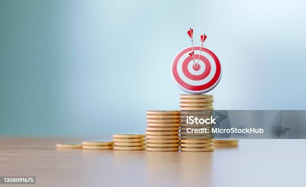 Success And Accuracy Concept Red Dartboard And Arrows Sitting Before Defocused Background Stock Photo - Download Image Now