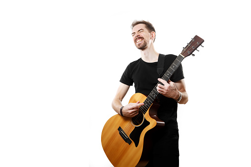 man playing on the guitar on the white background