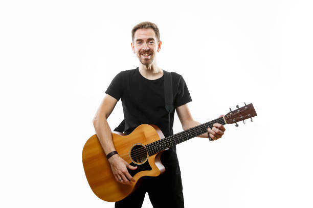 istock man playing on the guitar on the white background. 1308091772