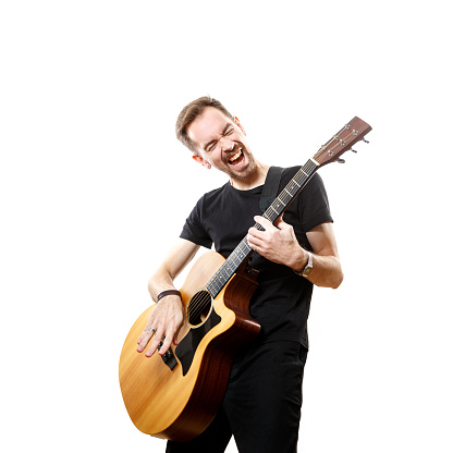 Young man playing guitar isolated on white background