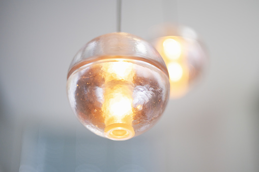 Illuminated Glass Sphere of Modern LED Chandelier. Selective Focus Detail.