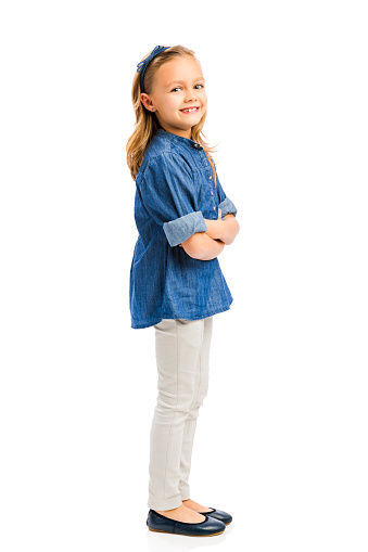 Studio portrait of a cute blonde girl, isolated in white background