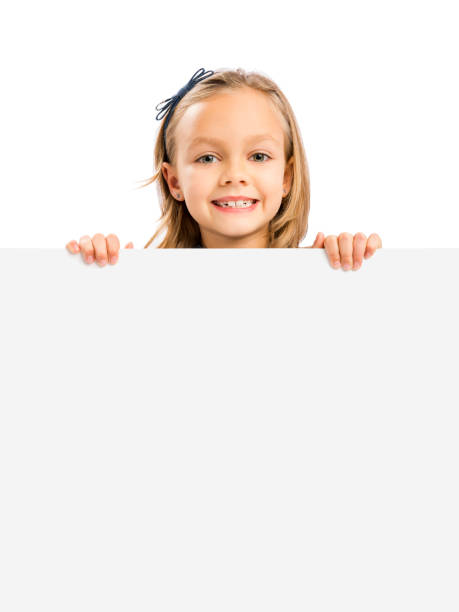 istock Cute Girl holding a whiteboard 1308092959