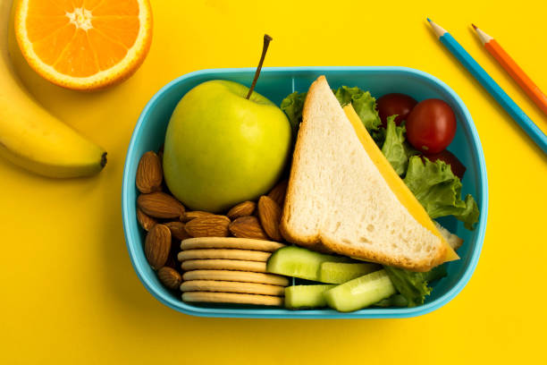 Lunch box on the yellow background.Top view. Lunch box on the yellow background. Top view. Close-up. lunch box photos stock pictures, royalty-free photos & images