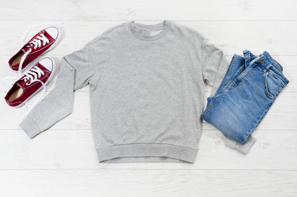 istock Close up gray blank template sweatshirt hoodie with copy space. Top view mockup pullover on white wooden background. Casual outfit. Flat lay template clothes. 1308095997