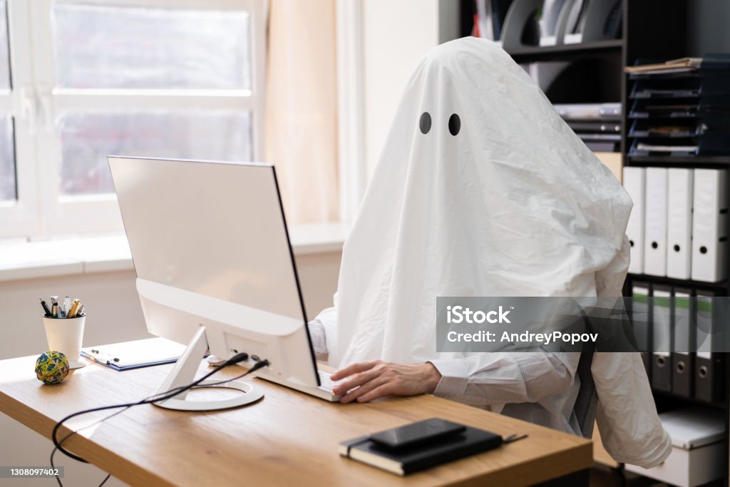 Ghostwriter In Office. Creative Ghost Writer Ghostwriter In Office. Creative Ghost Writer Using Computer Office Stock Photo