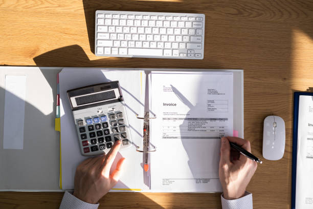 istock Financial Advisor With Calculator And Bill 1308097486