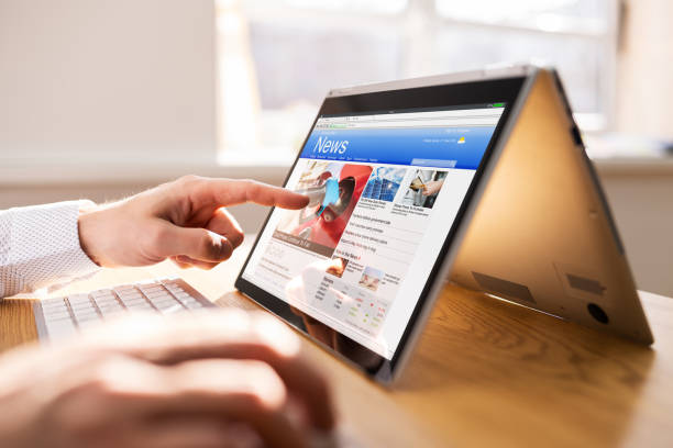 istock Reading Online News Media. Looking At Newspaper 1308097490