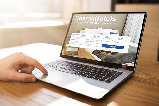 Online Hotel Booking Application Website On Laptop Computer