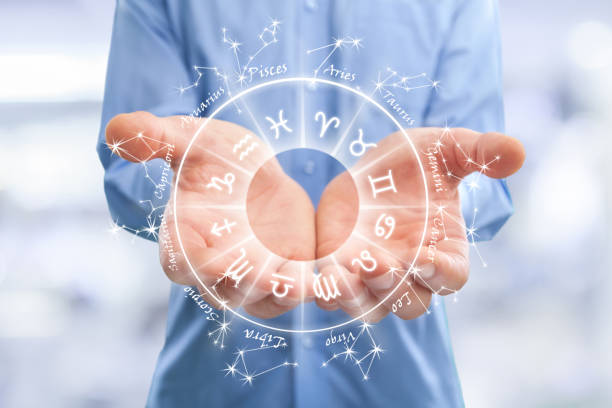 istock Men's hands hold the image of the zodiac 1308097583