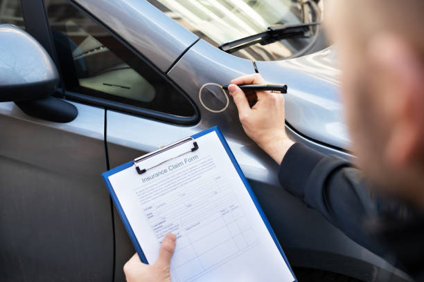 istock Insurance Agent Or Adjuster Inspecting Car 1308098230
