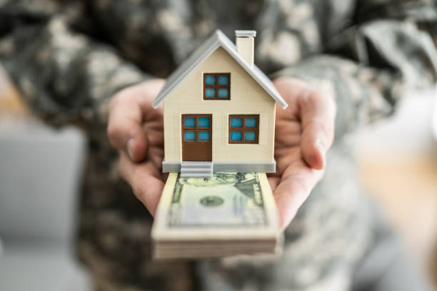 istock SCRA Program. Military Army Man Holding New House 1308098307