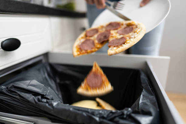 istock Food Waste. Throw Away Pizza 1308098603
