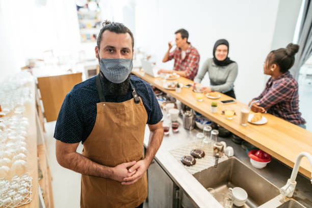 istock Multi ethnic group of people in cafe after reopening 1308099029