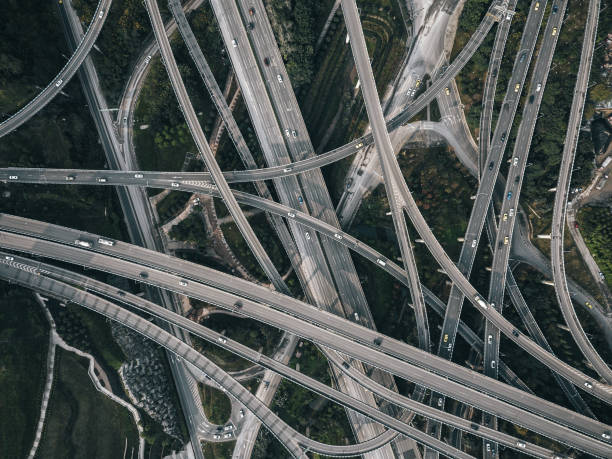 istock Aerial View of Complex Overpass and Busy Traffic 1308099994