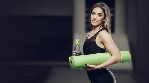 istock strong athletic young girl working out in gym 1308100257