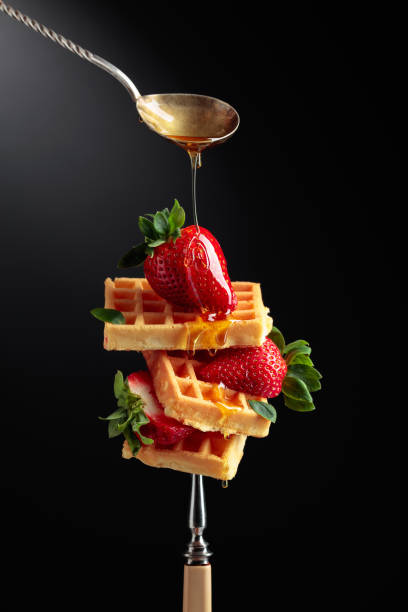 istock Waffles with strawberries and honey. 1308100925
