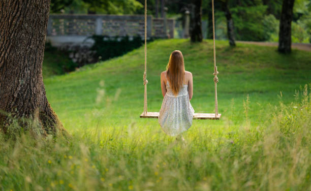 istock Young Woman Swinging 1308101318
