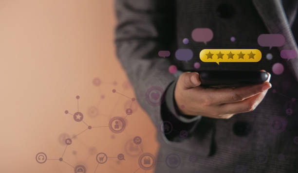 istock Customer Experiences Concept. Happy Client Using Smartphone to Giving Best Excellent Review Rating for Online Satisfaction Surveys . surrounded by Many Pop Up Feedback from others Floating over a Mobile Phone 1308102383