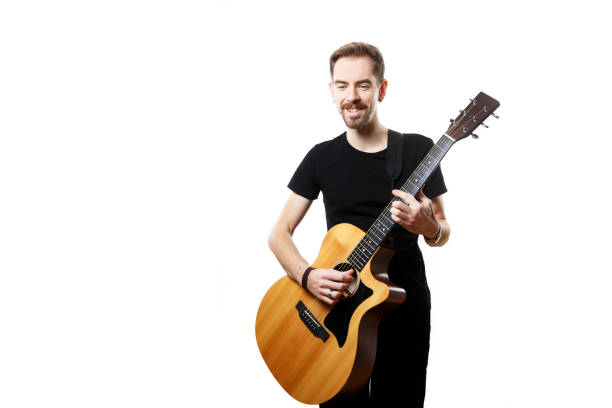 istock man playing on the guitar on the white background. 1308103656