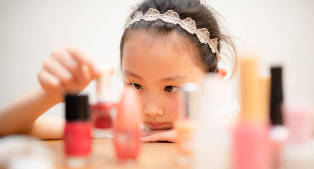istock Girl picking up cosmetics 1308105689