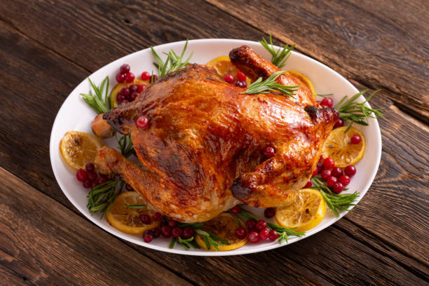 istock Thanksgiving or Christmas chicken  on wooden table gala dinner 1308106923