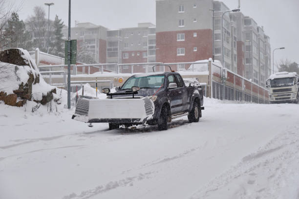 istock Pickup snowplow on the snow-covered street 1308107636
