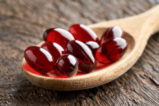 istock Krill oil pills on a spoon 1308110126