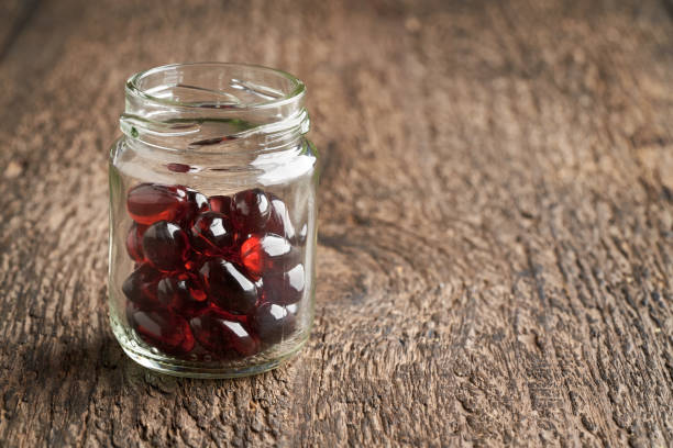 istock Krill oil capsules in a glass jar on a table 1308110136
