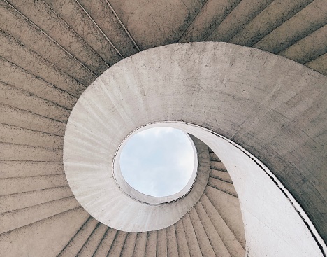 Brutalist spiral staircase with a view of the sky located in Warsaw, Poland