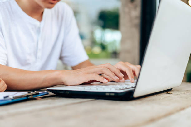 istock High school or college students  group catching up workbook and learning tutoring on desk and reading, doing homework, lesson practice preparing exam. 1308114976