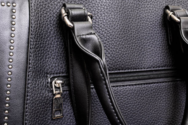 istock Black Leather women bag with handles closeup 1308117151