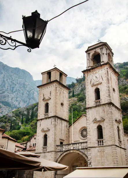 Photo of Kotor Clock tower with mountains looming from behind,Montenegro,Eastern Europe.