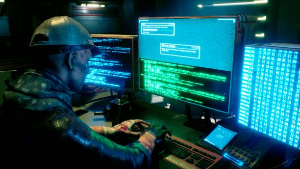 istock A male hacker surrounded by glowing monitors hacks into someone else's computer network in a dark room of his office. 3D Rendering. 1308121400