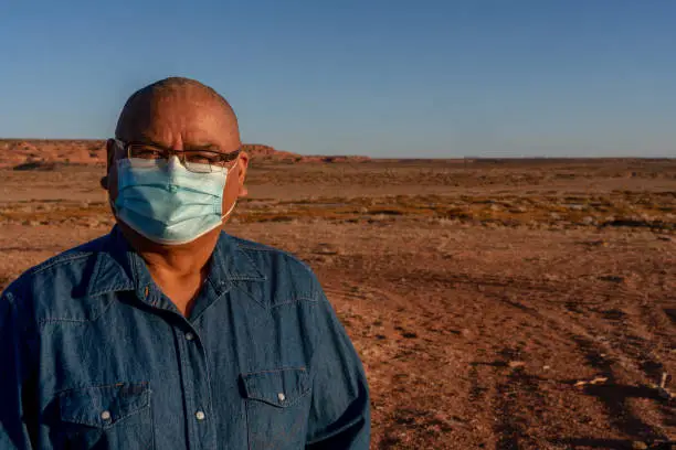 Photo of Middle Aged Navajo Man on his Rural Property in Monument Valley Utah near Arizona During the Covid-19 Corona Virus Pandemic