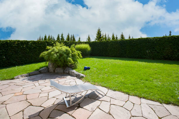 istock Natural stone terrace with green garden 1308125996