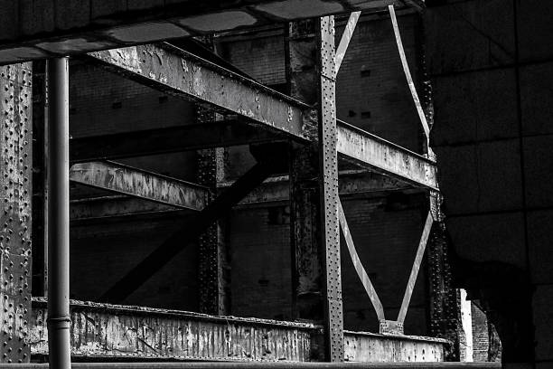 Close-up of an old rusty metal frame inside a derelict building