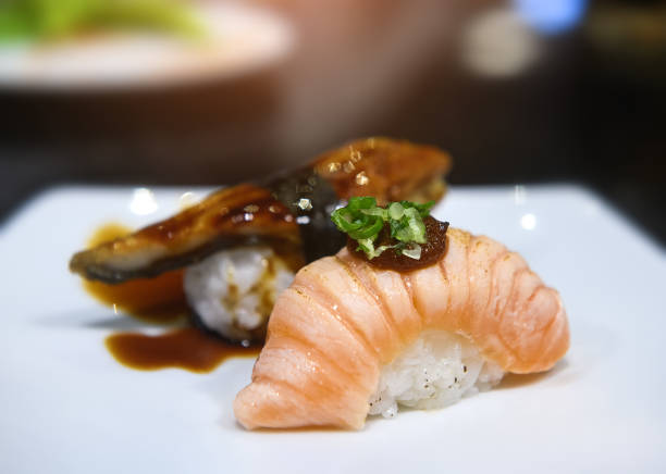 istock Japanese salmon belly slice and  burn sushi. 1308128205
