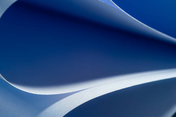 istock close up abstract with bent paper background ,selective focus;blue  colour . 1308128342