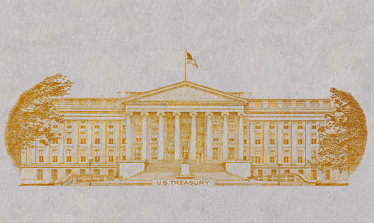 golden textured U.S. Treasury building cut from 10 dollar banknote for desin purpose