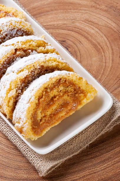 istock Swiss roll cake stuffed with dulce de leche. Roulade cake. Top view 1308128657