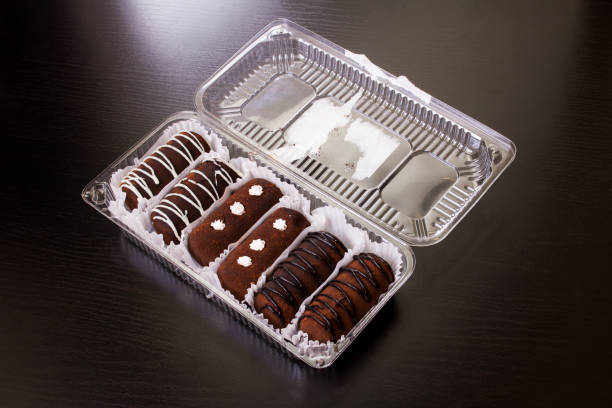 Chocolate cakes with cream closeup on wooden table