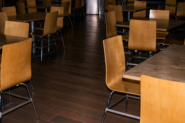 istock Tables and chairs in cafe in evening 1308129975