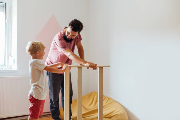 istock Father And Son Working On Carpentry At Home 1308133003